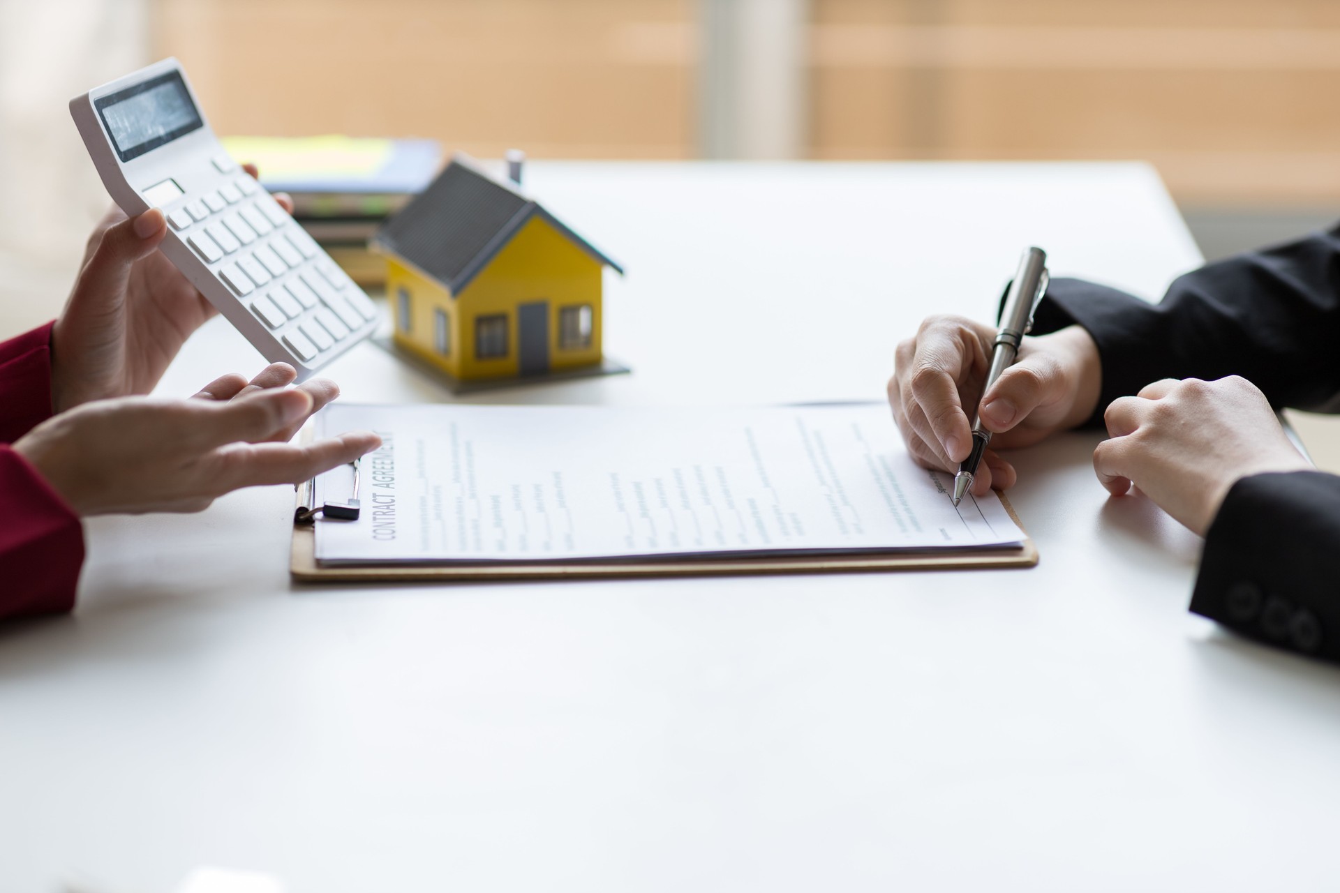 Businessman, real estate agents discuss house sale prices, fee, mortgage, interest, rent, cash flow, loan.