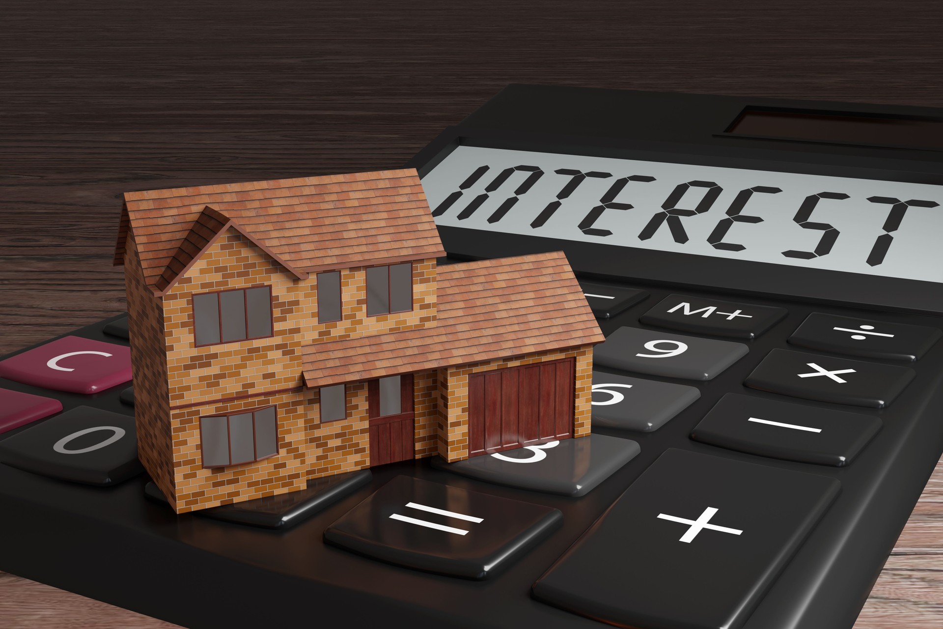 Una casa unifamiliar en una calculadora. Ilustración del concepto de préstamos hipotecarios, altos tipos de interés y problemas de vivienda